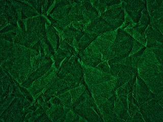 Texture of dark green crumpled craft paper. Texture for design, abstract background