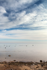 Fototapeta na wymiar Cloudy summer day by Baltic sea.