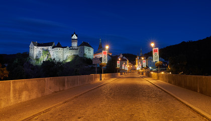 Panoramic, night view from a bridge on a Loket Castle (Hrad Loket, Burg Elbogen), impregnable...