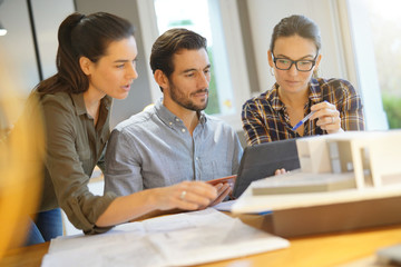 Architects looking over project for modern house design