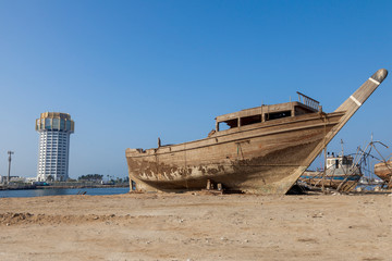 Abandoned Boat Wreck on the Beach at the Fish market Jeddah Saudi Arabia