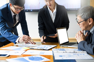 Team work process. young business managers crew working with startup project. laptop in office analyze profit graph plan