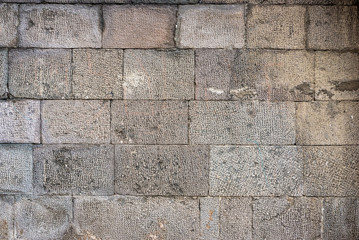 Detail of a stone wall with different size of rocks.