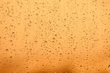 Gold tone for drops of water or rain drops on window glass