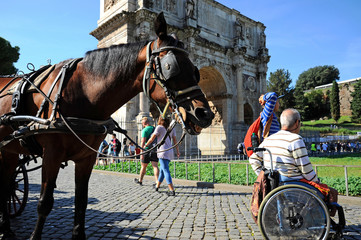 ROME, Italy – October 09, 2018:  A Man in wheelchair enjoying outdoors roman vacations. On the...