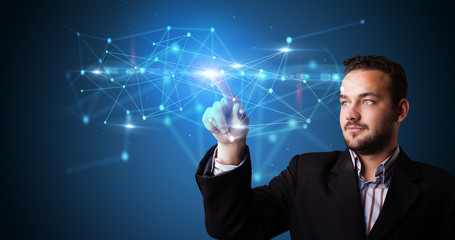 Man touching hologram screen displaying modern web system
