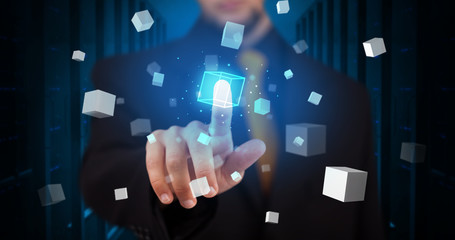 Man touching hologram screen displaying cube symbols
