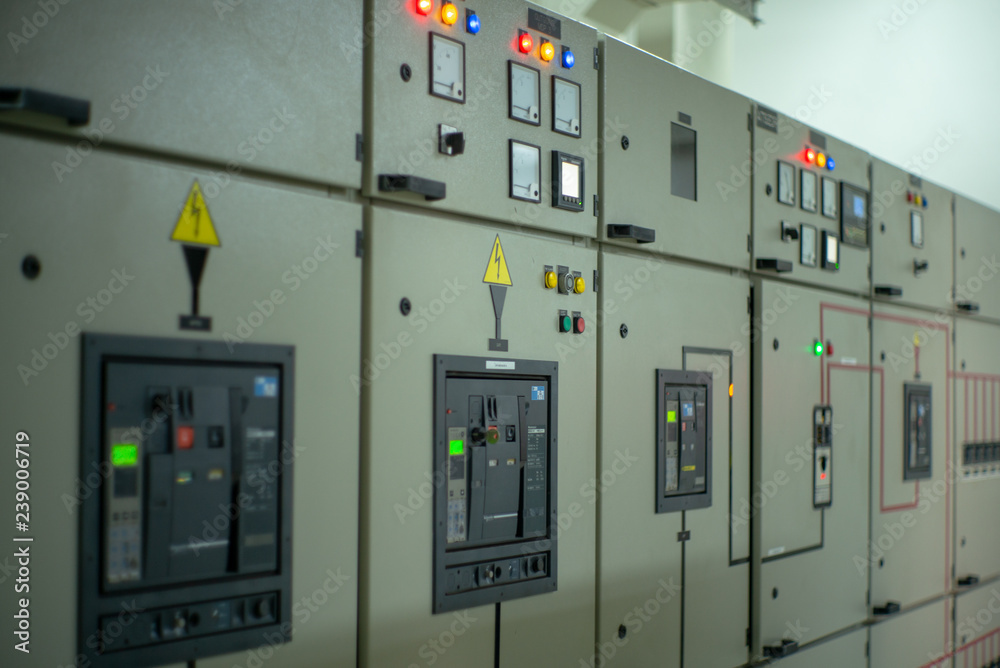 Wall mural closeup lighting indicator on the control carbinet in the electrical room.