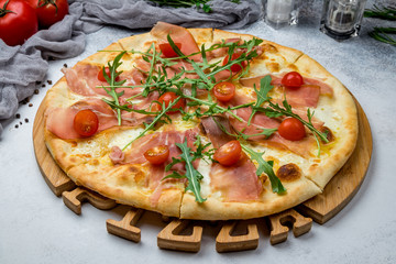 Pizza with Parma ham and arugula