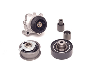 Set of rollers of the automobile engine timing system and the cooling pump on a white background,...