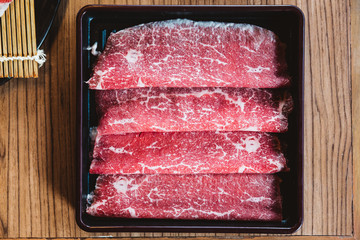Rare slices authentic A5 Grade Japanese Wagyu beef with high-marbled texture for Shabu.