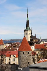 Obraz premium View of the towers and roofs of Old Tallinn from the fortress wall