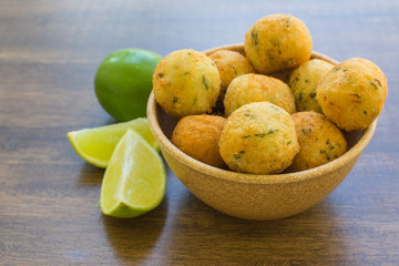 bolinhos de bacalhau - codfish in Portuguese - delicious salty Brazilian cuisine on the table