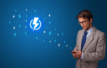 Young person using phone with power concept

