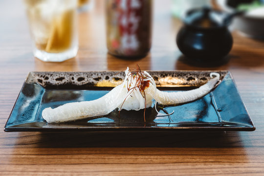 Fish fin sushi Engawa sushi topping with saffron, traditional Japanese food.