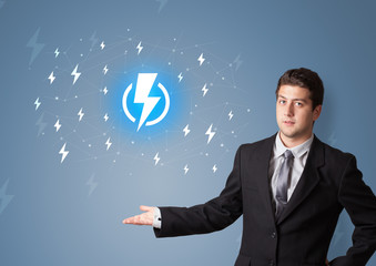 Young smiling person presenting battery life concept
