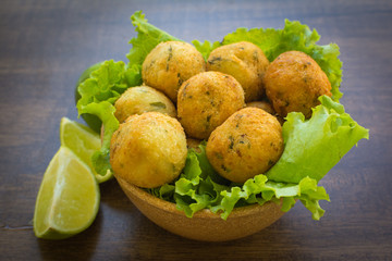 bolinhos de bacalhau - codfish in Portuguese - delicious salty Brazilian cuisine on the table