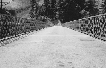 An empty bridge over a steep ravine in the Swiss Alps - 2