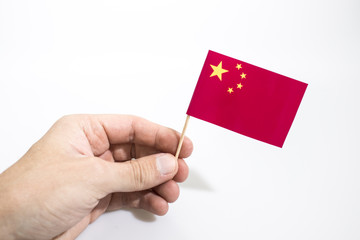 Obraz premium Hand is holding china flag isolated in a white background