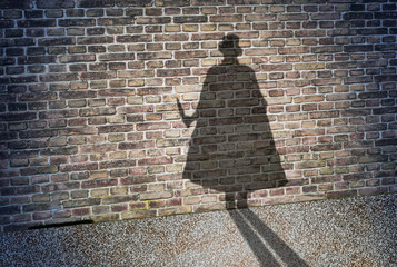 Shadow on the wall of Jack the Ripper - obrazy, fototapety, plakaty
