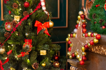 Christmas tree decorated with toys. And a decorative star