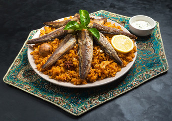 Fish Kabsa - mixed rice dishes that originates in Yemen. Middle eastern food.