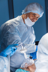 Portrait of experienced doctor or surgeon during the operation