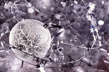 Christmas ball. New Year composition with the ball in silver tones. Christmas background.
