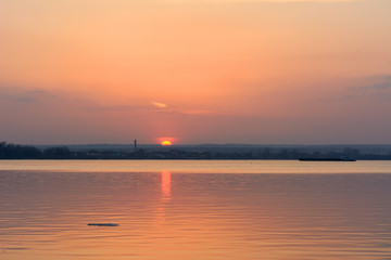 Fototapeta na wymiar Sunset over the river in the spring