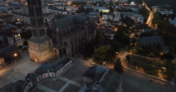 Historical aerial view of Limoges Cathedral illuminated at dusk, France