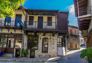 Street view of Stemnitsa village, a popular winter destination in mountainous Arcadia in Peloponnese, Greece. Paved alleys with traditional stone houses
