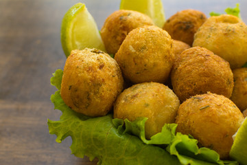 bolinhos de bacalhau - codfish in Portuguese - delicious salty Brazilian cuisine on the table