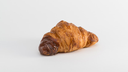croissant with chocolate filling on a white background