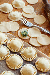 Making ravioli with ricotta cheese and spinach