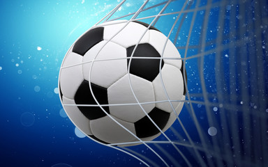 Soccer ball in goal on blue