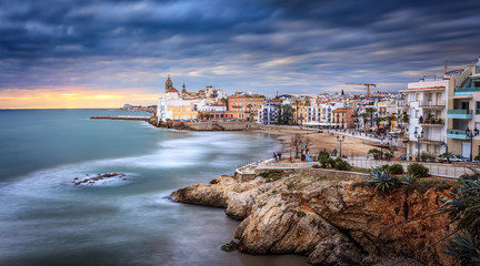 Fototapeta na wymiar Sunset over Sitges, Catalunya, Spain. Sitges is a famous town near Barcelona, famous for it's nightlife and beaches. It is a gay friendly city.