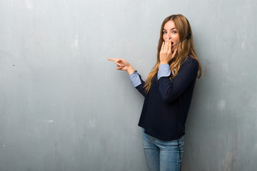 Telemarketer woman pointing finger to the side with a surprised face