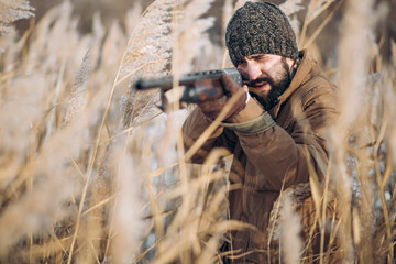 Fototapeta premium young ambitious man hunting an animal for its meat. close up photo. environmental issue