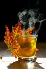 yellowed leaf and green herbal tea
