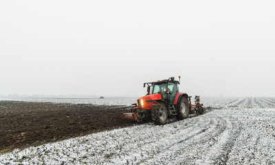 Tractor plowing a field