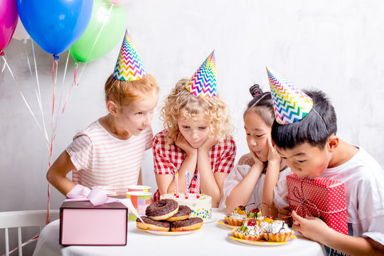 happy children are ready to taste Birthday cake. closeup photo.