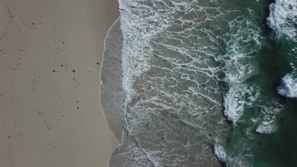 DRONE GOING INTO THE SEA BLUE WAVES