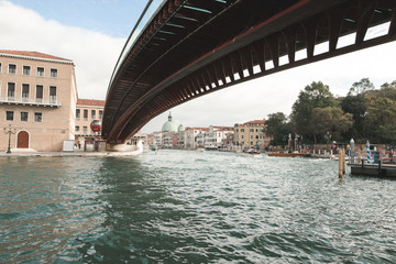 Landscape of Venice, Italy on a bright sunny day from under the bridge.