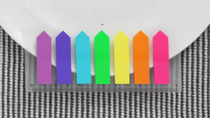 empty white plate and colorful tags