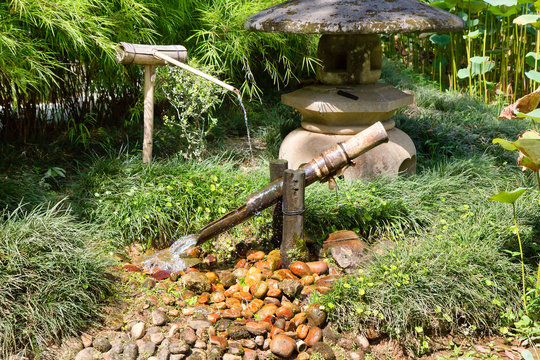 Rio de Janeiro, Brazil, Japanese corner in the Botanical garden. Japanese bamboo fountain. Another cozy corner of the garden is a Japanese garden. with all its inherent attributes