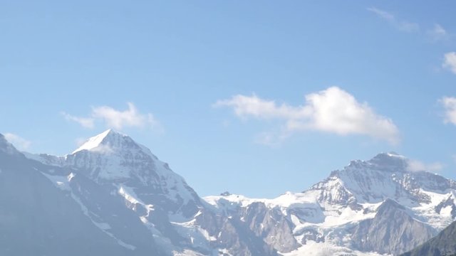 Alpine peaks landskape background. Jungfrau, Bernese highland. Alps, tourism and adventure hiking concept