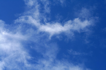 Fototapeta premium White clouds in the bright blue sky