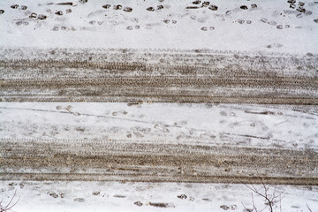 Snow covered road with tire tracks