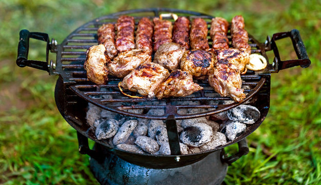 The juicy grilled sirloin beef together with chevapchichi somewhere in the countryside.