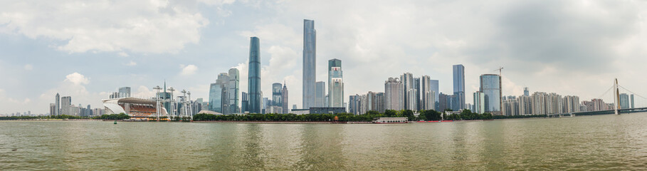 Fototapeta na wymiar The new city of Guangzhou on blue sky background, China, August 2017.
